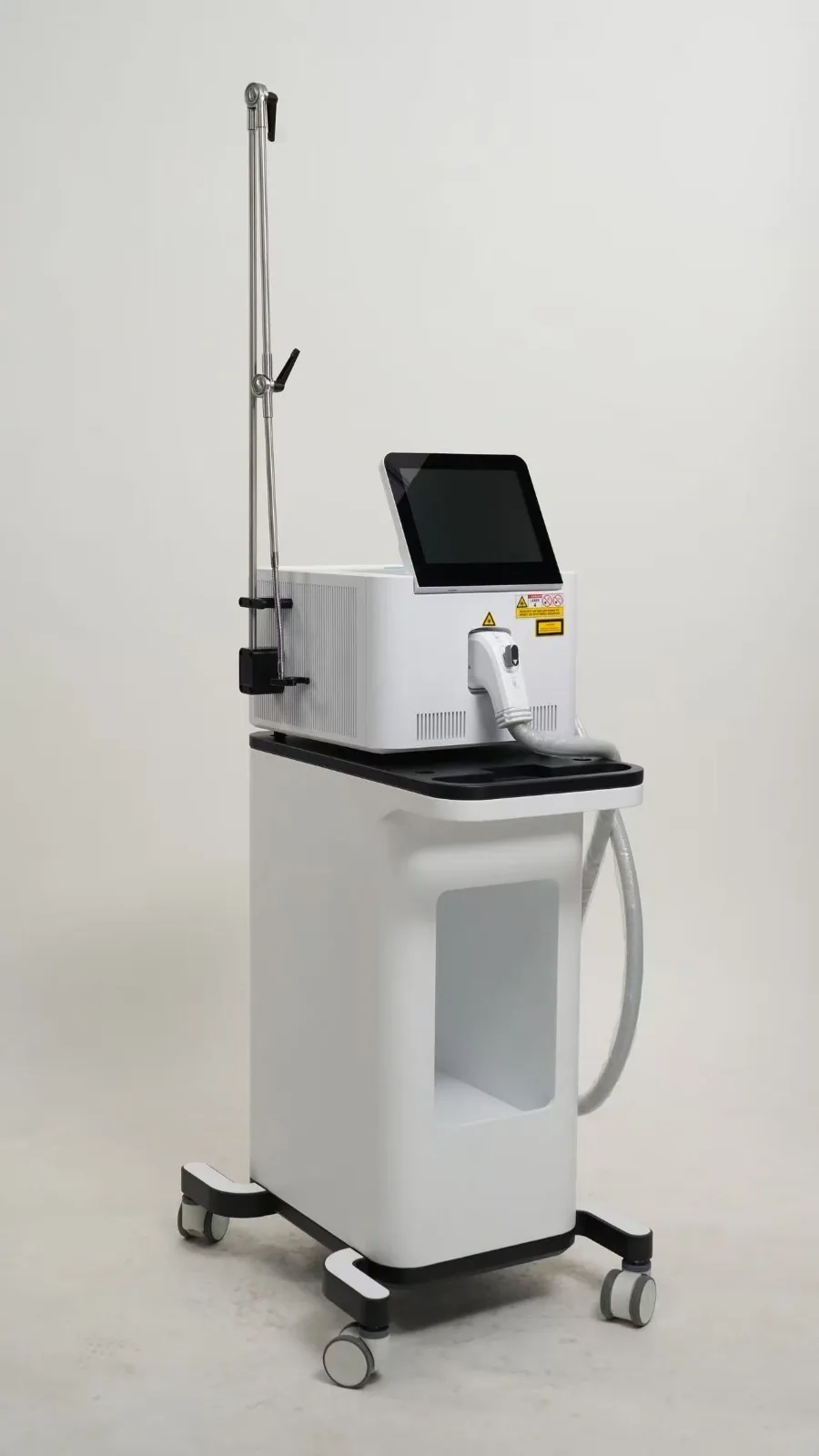 HR-LASE™ tri-wavelength diode laser on stand, ready for clinical use.